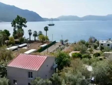 Detached House For Sale On 2000M2 Plot Of Land By The Sea In Marmaris Söğüt Neighborhood. Suitable For Tying A Boat In Front Of It.